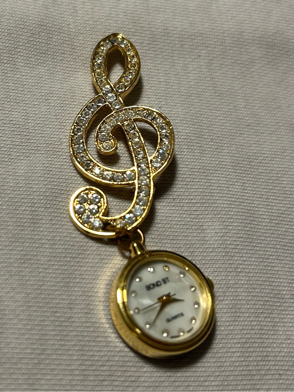 Gold Treble Clef Bond St Pendant Quartz Watch with Crystal Accents